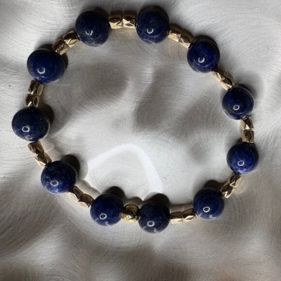 bracelet features polished deep navy-blue gemstone beads - Picture 1 of 3